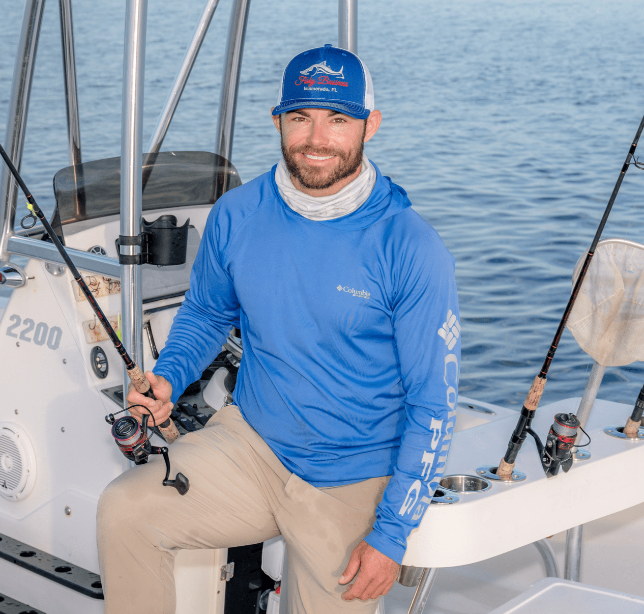 Captain Drew holding a fishing pole