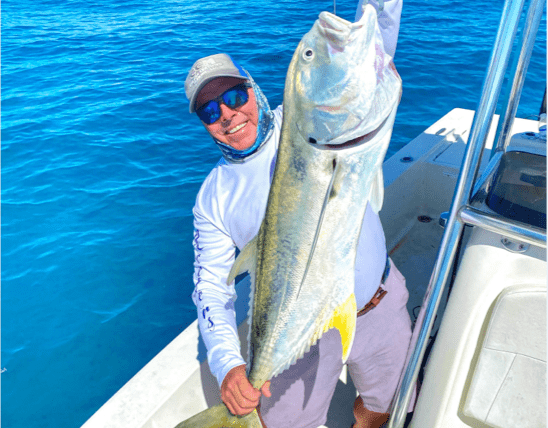 Man holding a freshly caught fish