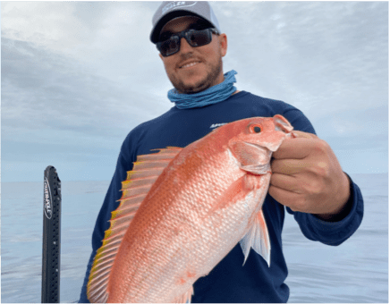 Man posing with a Vermillion Snapper